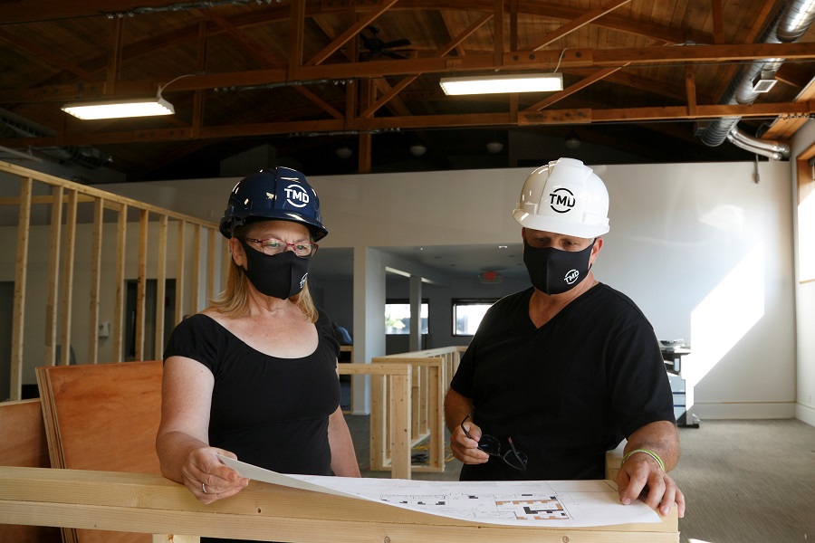Dave Cliche and Diane Allen reviewing TMD's new office plans