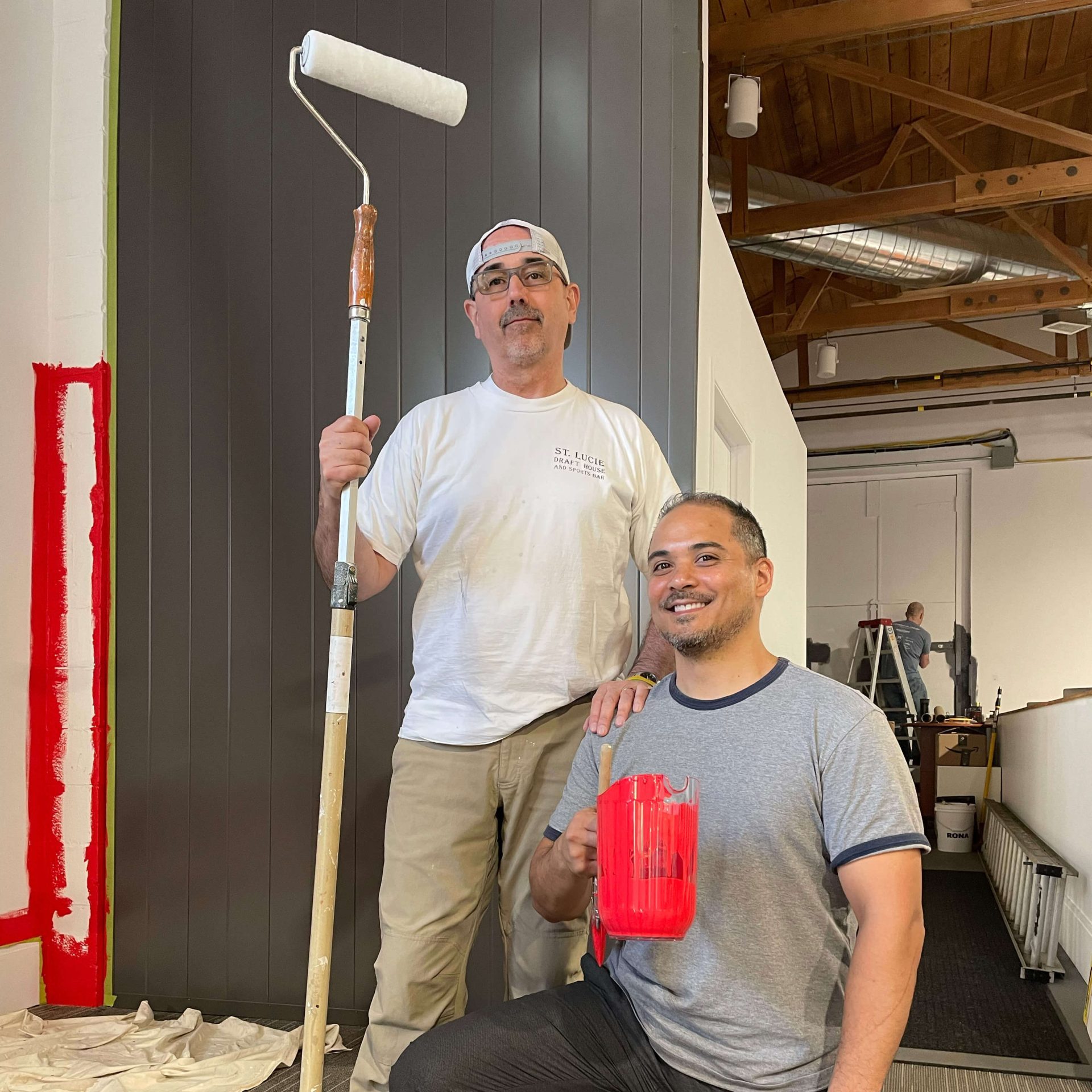TMD employees painting the office
