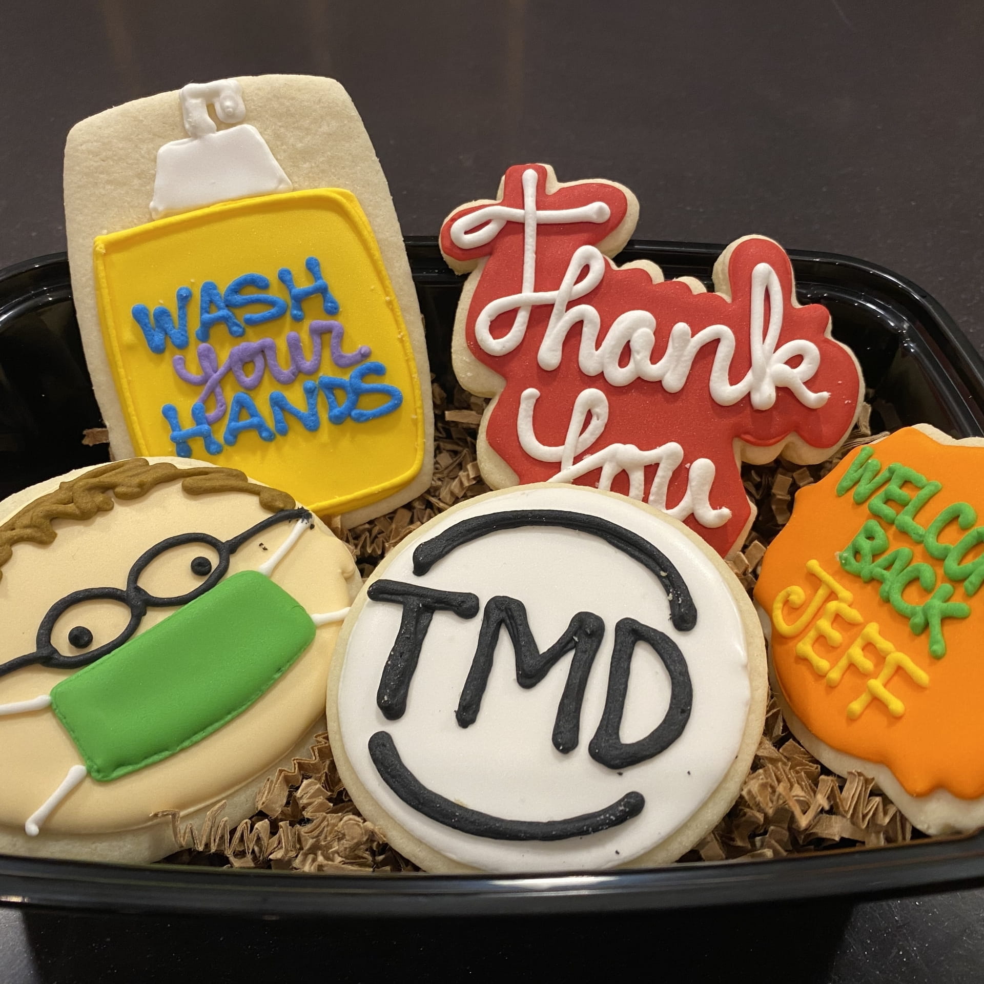 Tupperware with cookies celebrating an employee